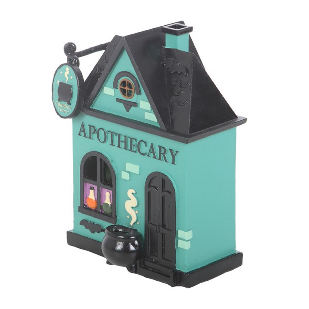 Model of a 'Apothecary' building with a sign and decorative elements on a white background
