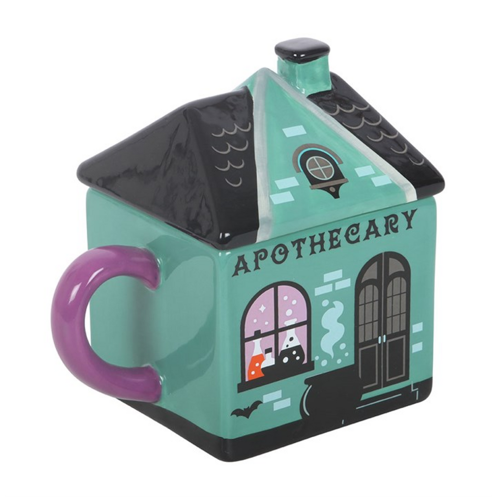 Mug shaped like a house with 'Apothecary' text on a white background