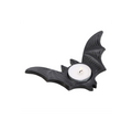 Black bat-shaped candle holder with a lit white candle on a white background