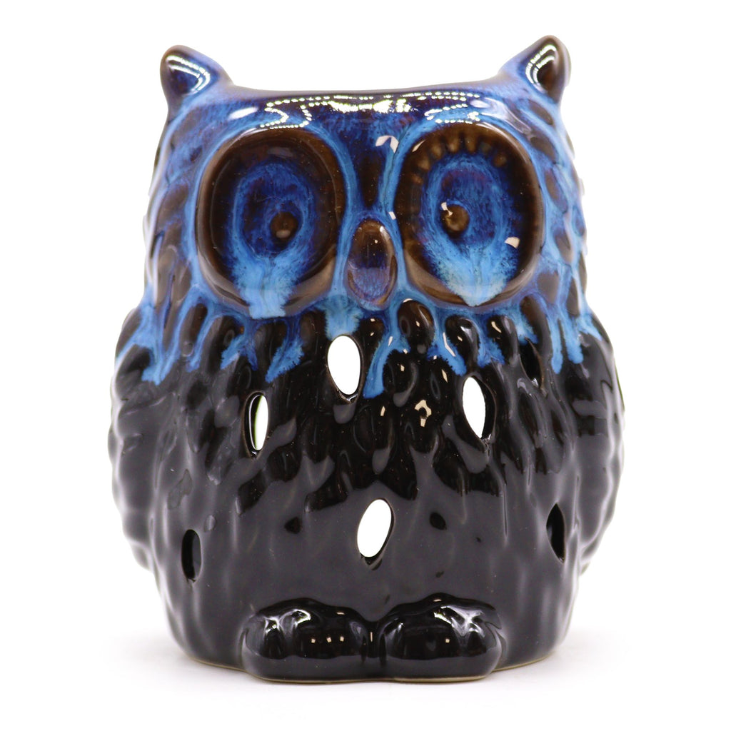 Ceramic owl-shaped candle holder with blue face and black body on a white background