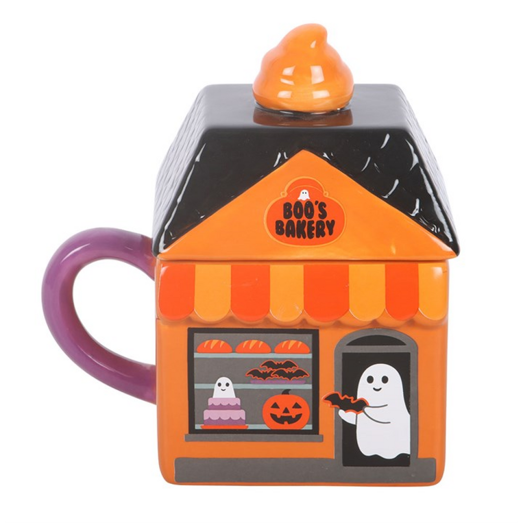 Halloween-themed mug shaped like a bakery with a ghost and pumpkin design on a white background