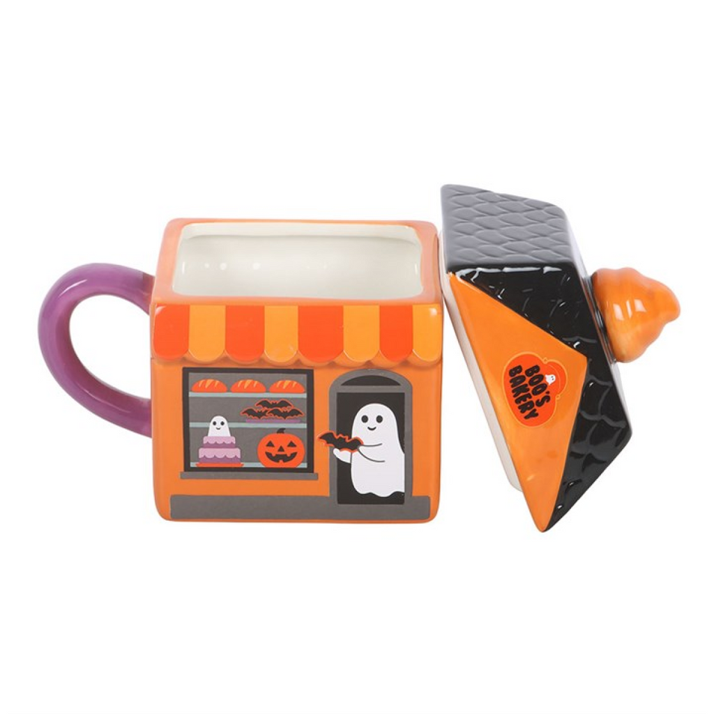 Halloween-themed mug with a ghost and candy corn design on a white background