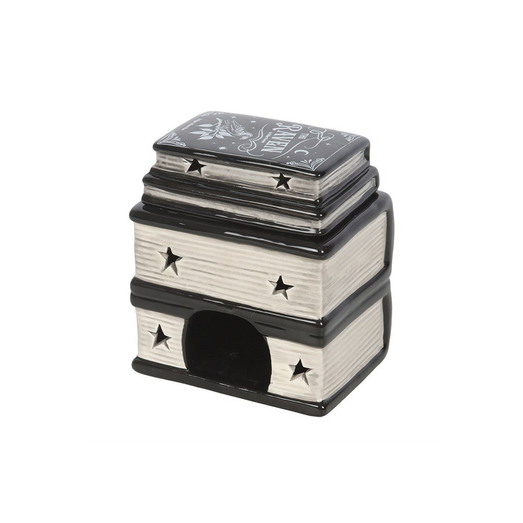 Decorative book-shaped container with star patterns on a white background