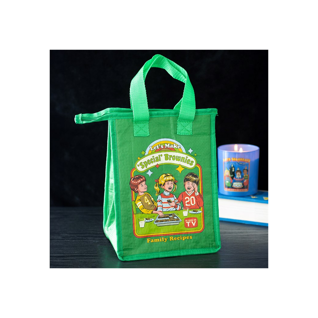 Green tote bag with cartoon characters and text on a dark surface