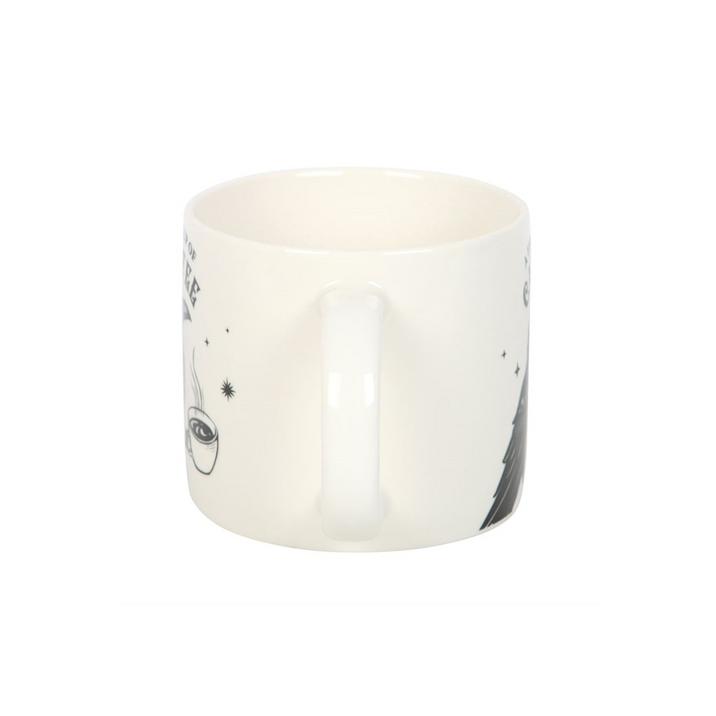 White ceramic mug with black abstract design on a white background