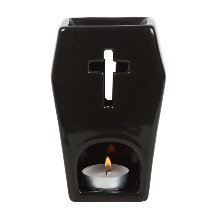 Black ceramic oil burner with a cross design on a white background