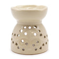 Beige ceramic oil burner with perforated design on a white background