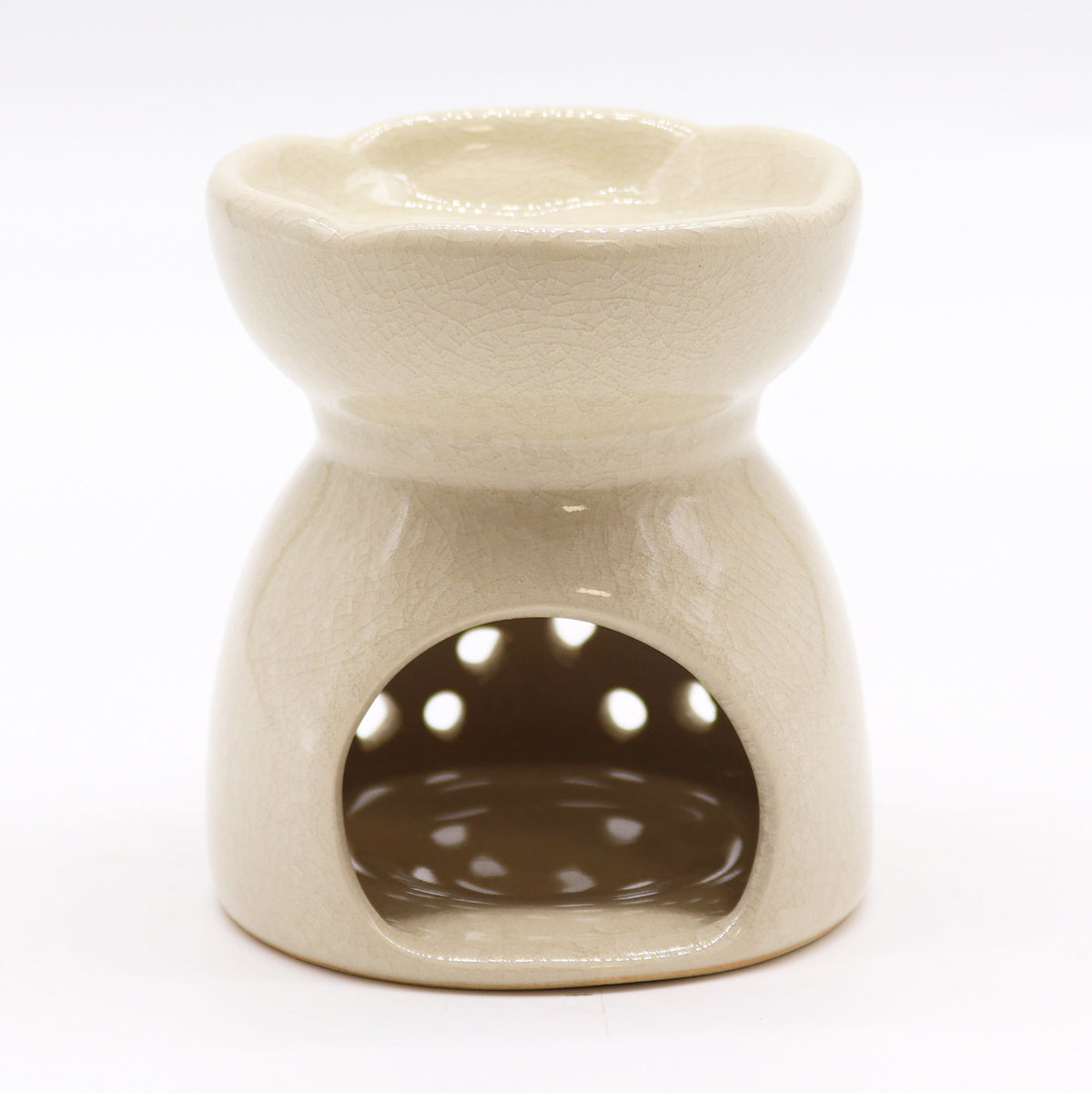 Beige ceramic oil burner on a white background