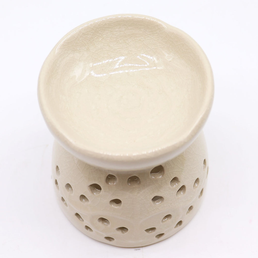 Beige ceramic diffuser with perforated design on a white background