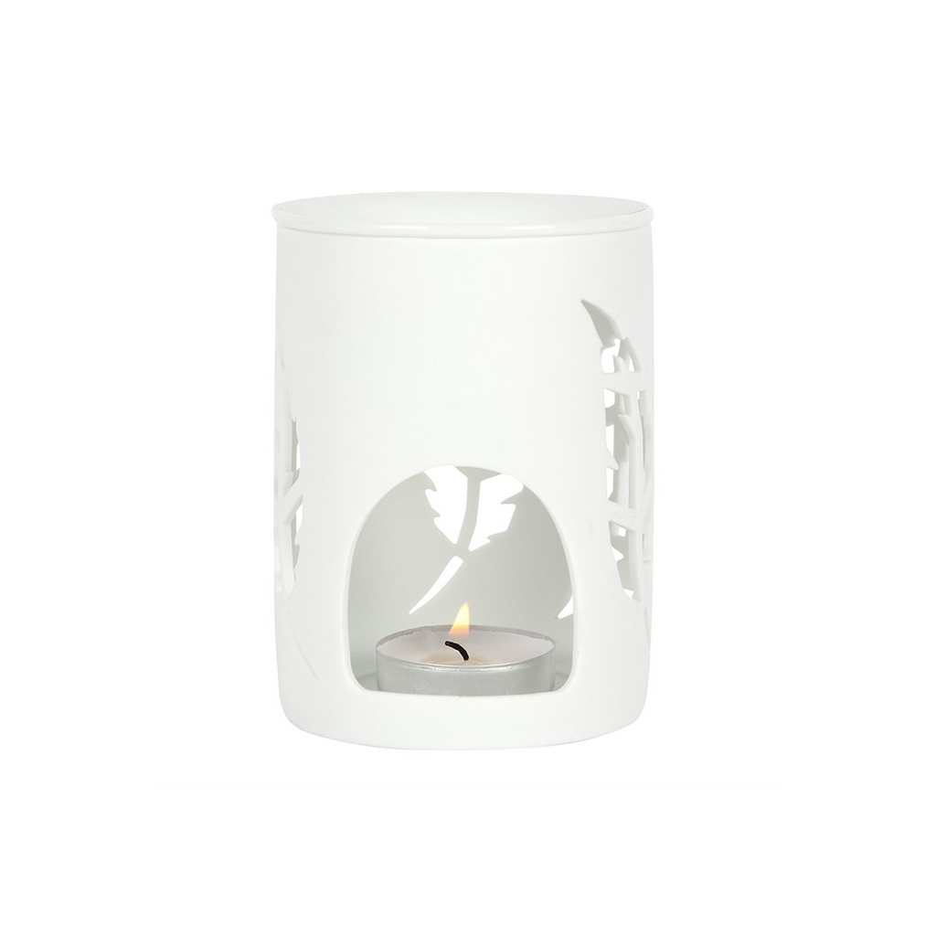 White candle holder with cut-out design on a white background