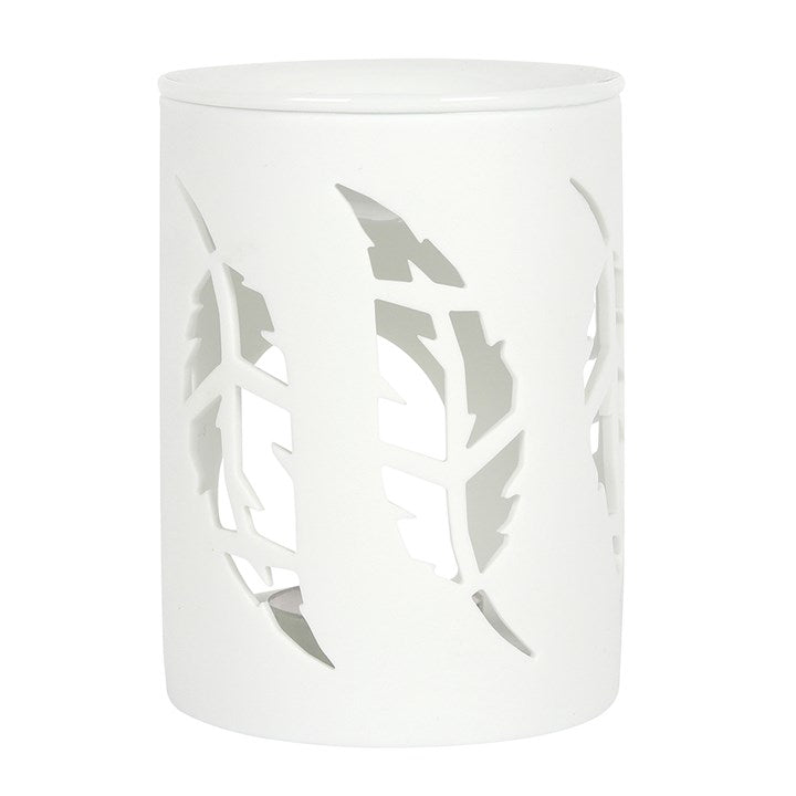A white cylindrical decorative lamp or diffuser with a lid, featuring large leaf-shaped cutouts on the front.