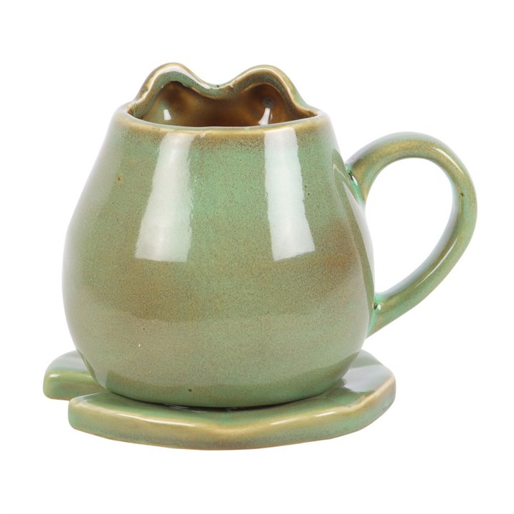 Green ceramic mug with handle on a white background