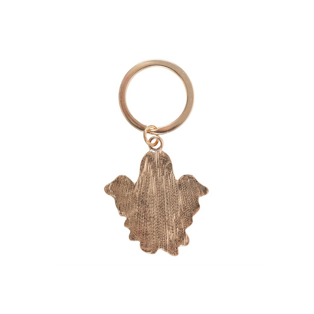 Bronze-colored keychain with a unique design on a white background