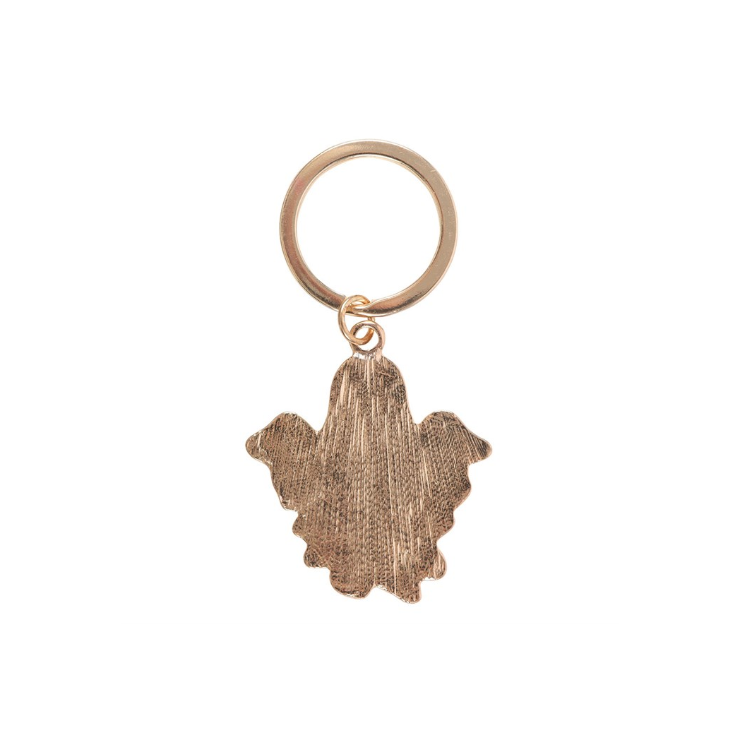 Bronze-colored keychain with a unique design on a white background