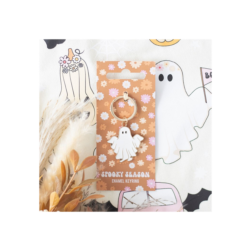 Spooky season enamel keyring with packaging on a white background
