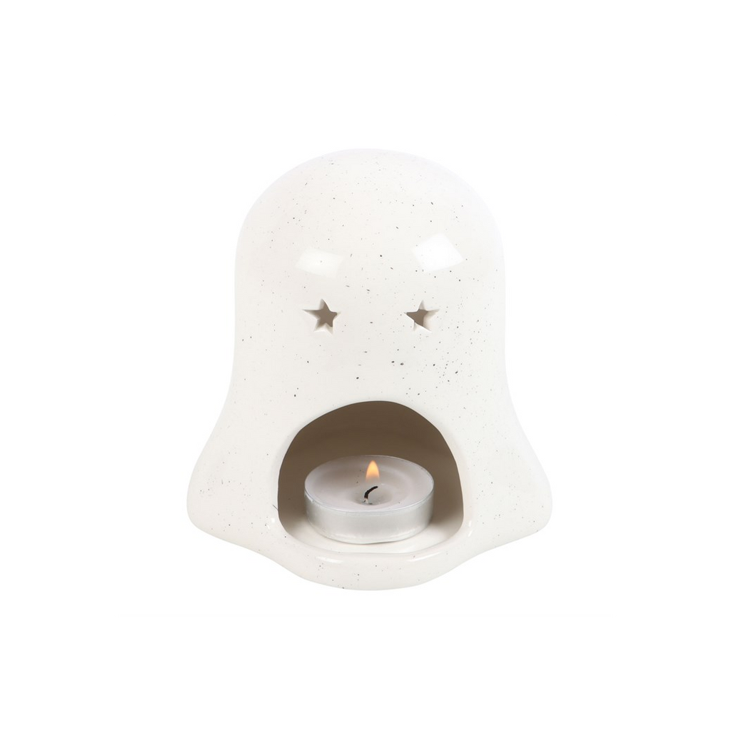 White ceramic candle holder with a lit candle inside on a white background