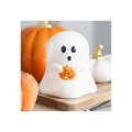 Halloween-themed ceramic ghost with pumpkin on a wooden board, surrounded by pumpkins.