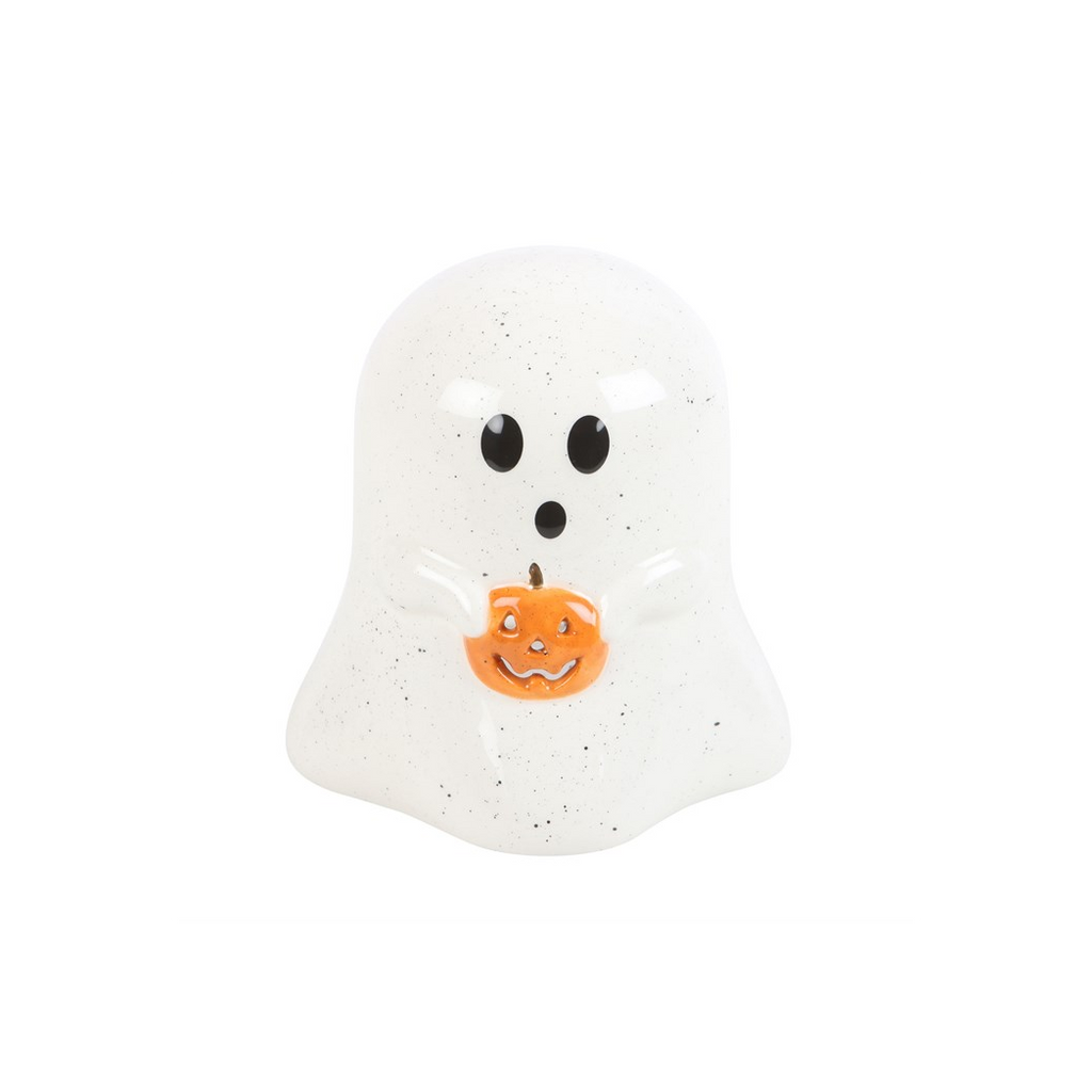 White ghost figurine with black eyes and an orange pumpkin on a white background