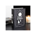 Book titled 'Ghost Stories to Tell in the Dark' with a candle in the background