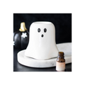 Ghost-shaped diffuser on a marble surface with pumpkins in the background