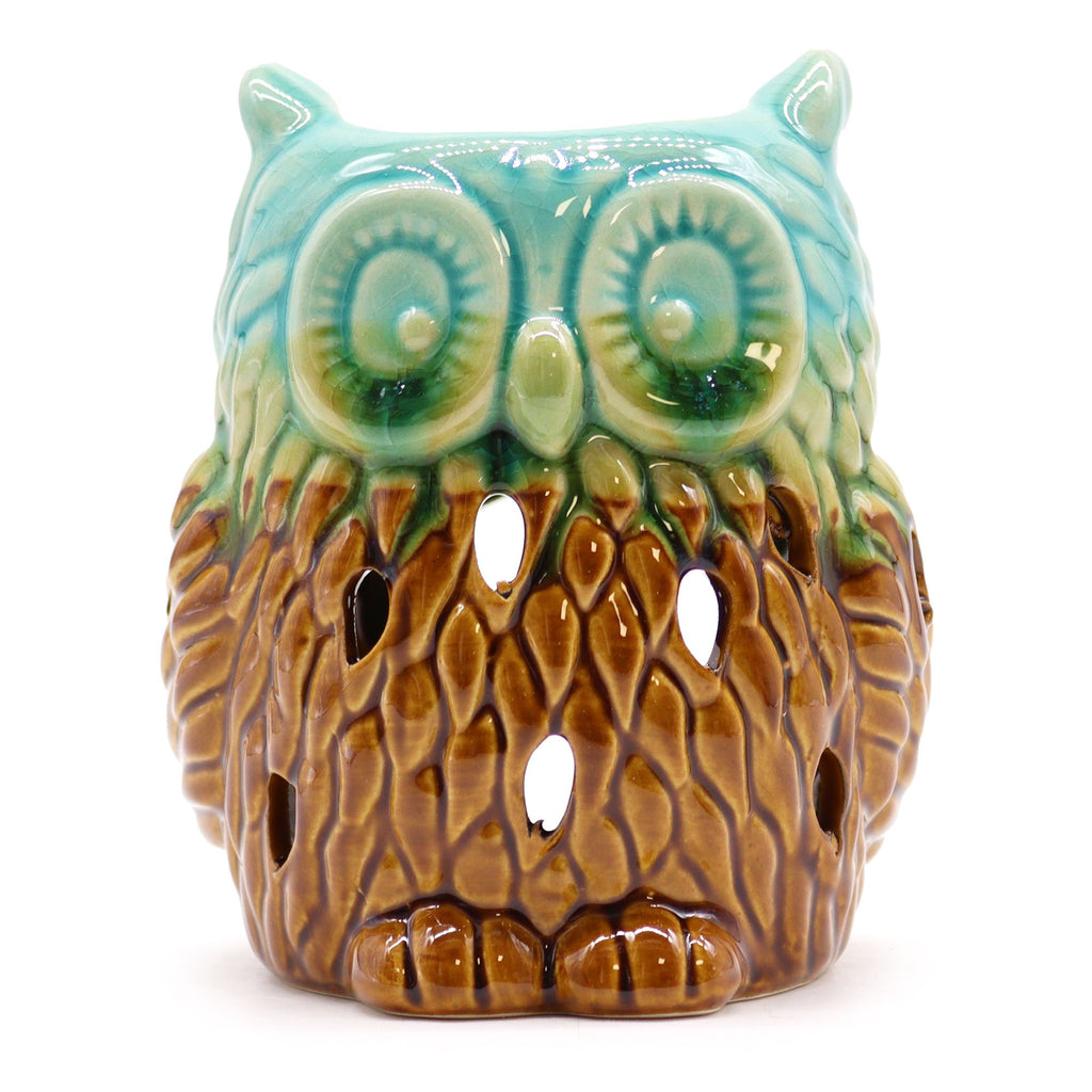 Ceramic owl-shaped lantern with teal eyes and brown body on a white background