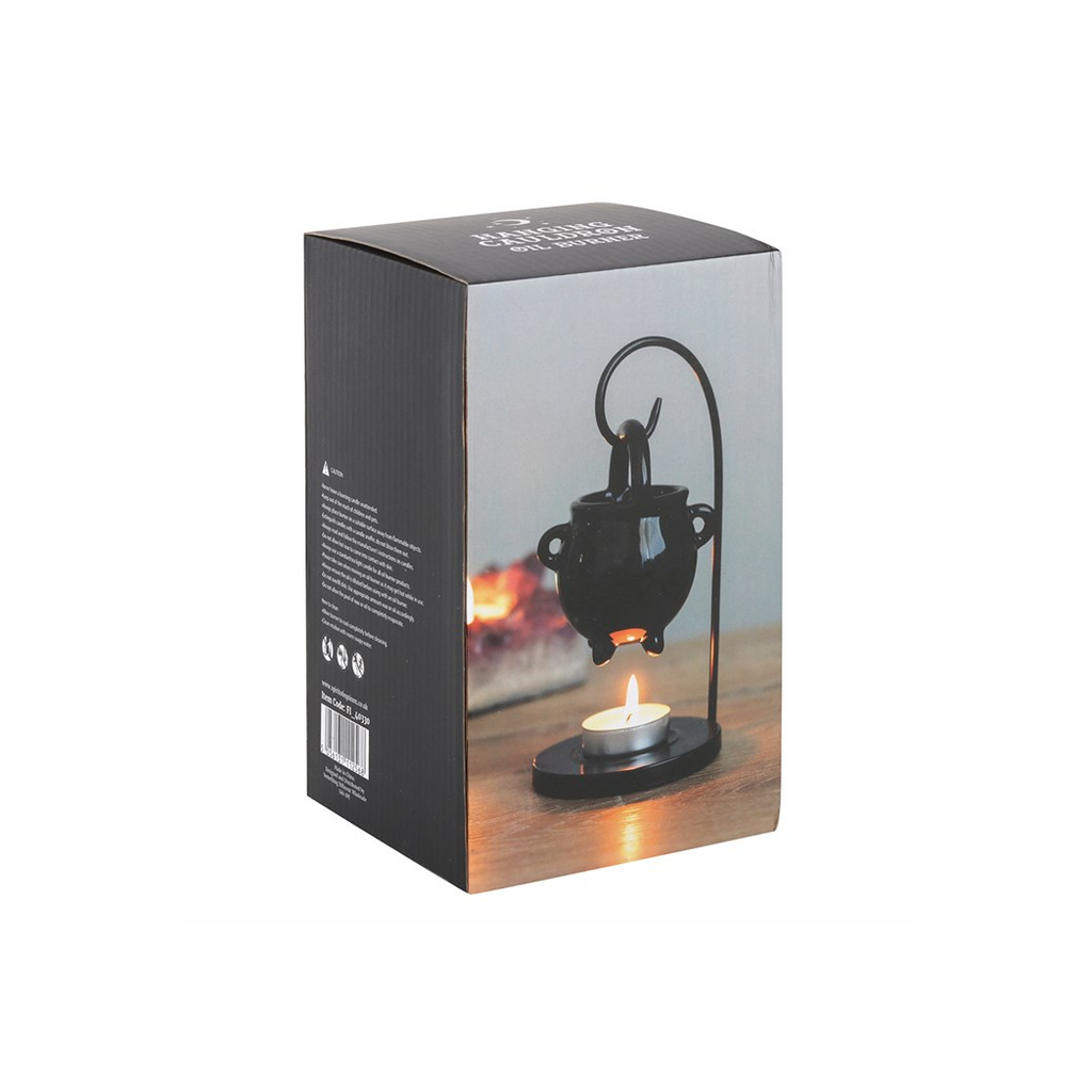 Product packaging with a black decorative lantern and candle on a wooden surface.