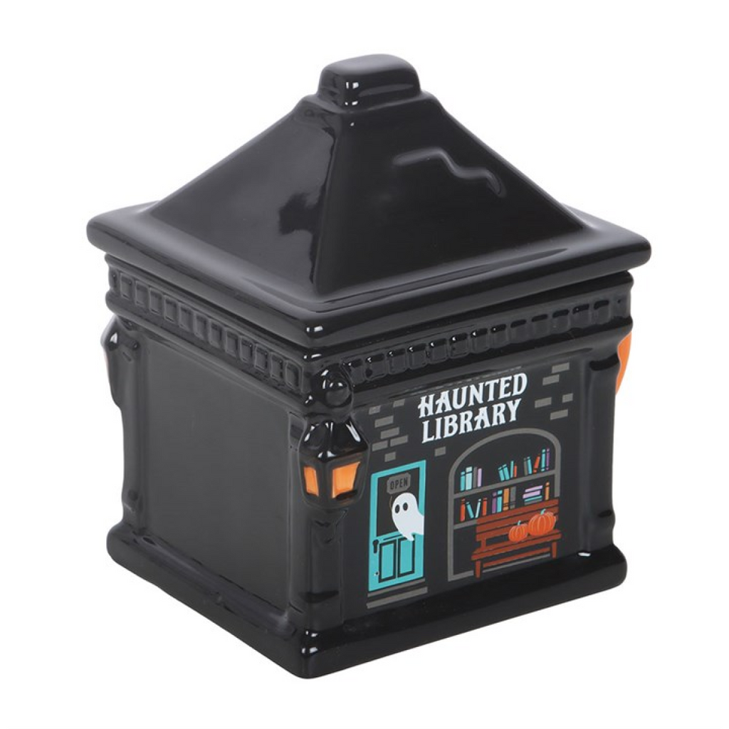 Black mug with 'Haunted Library' design on a white background