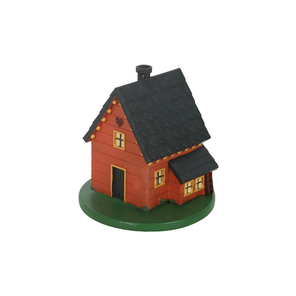 Small model of a wooden cabin with a black roof on a white background