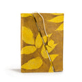 Notebook with yellow leaf pattern on a white background