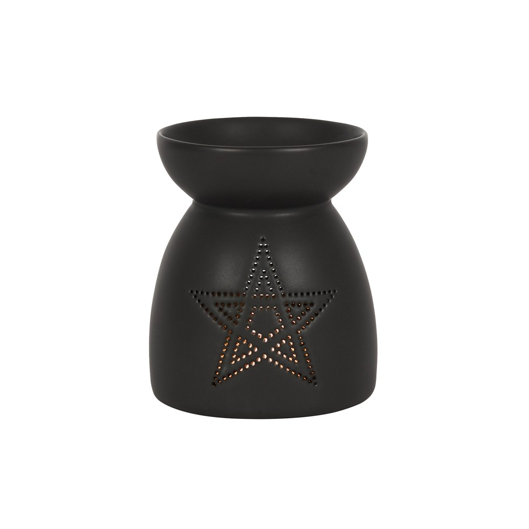 Black wax warmer with star design on a white background