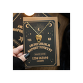 Heart-shaped pendant necklace on a card with Ouija board text, held by a hand.