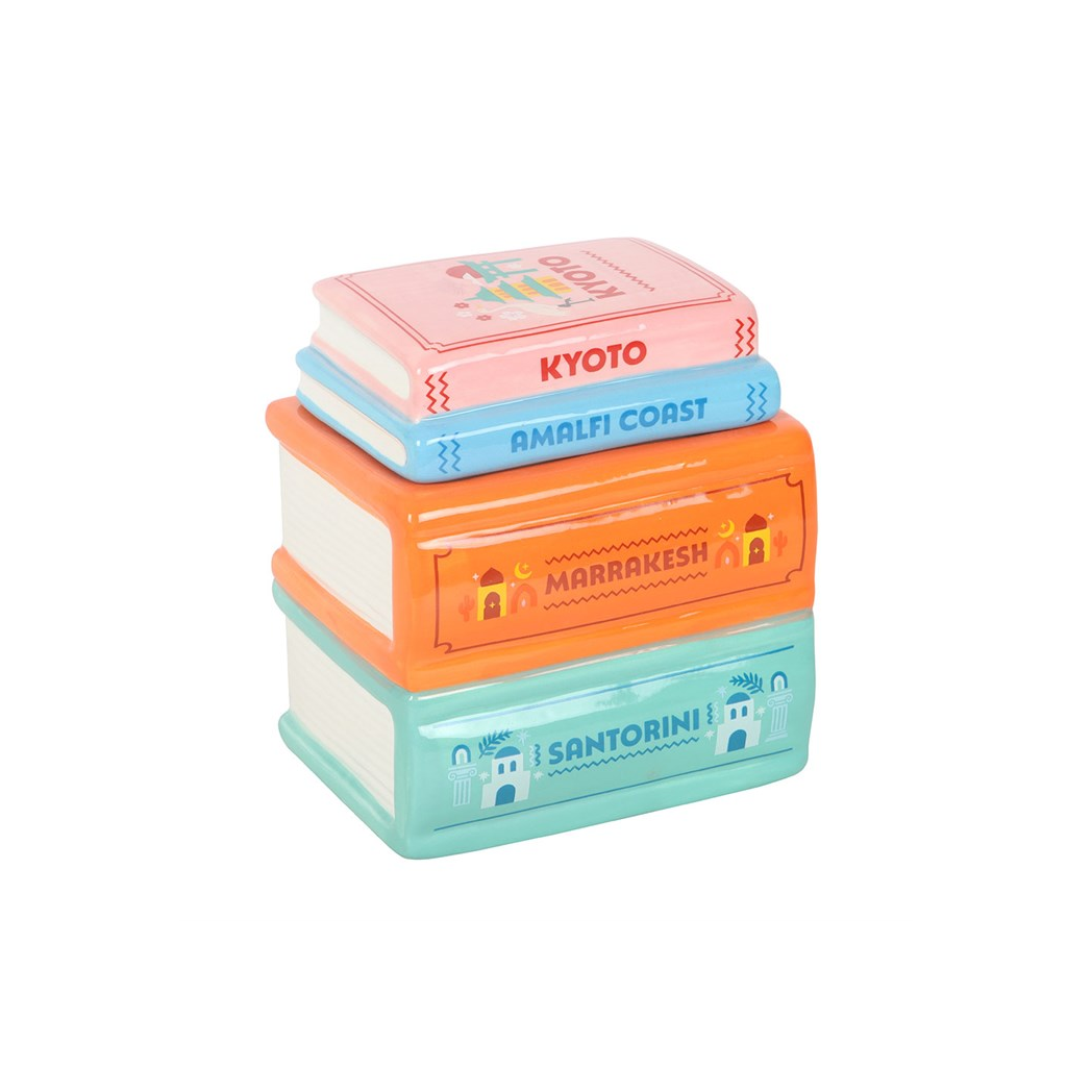 Stack of colorful travel-themed boxes on a white background