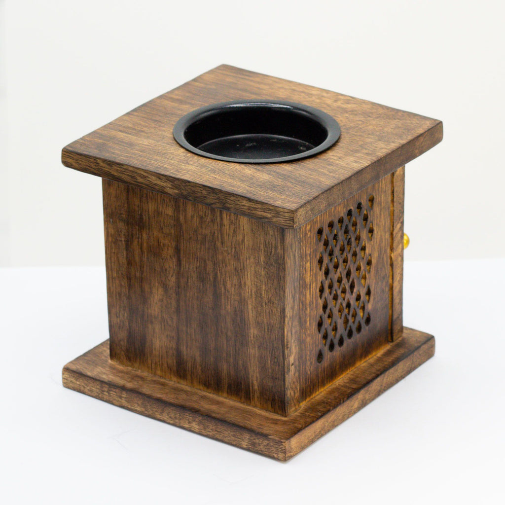 Wooden square oil burner with a black top on a white background