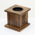 Wooden square oil burner with a black top on a white background